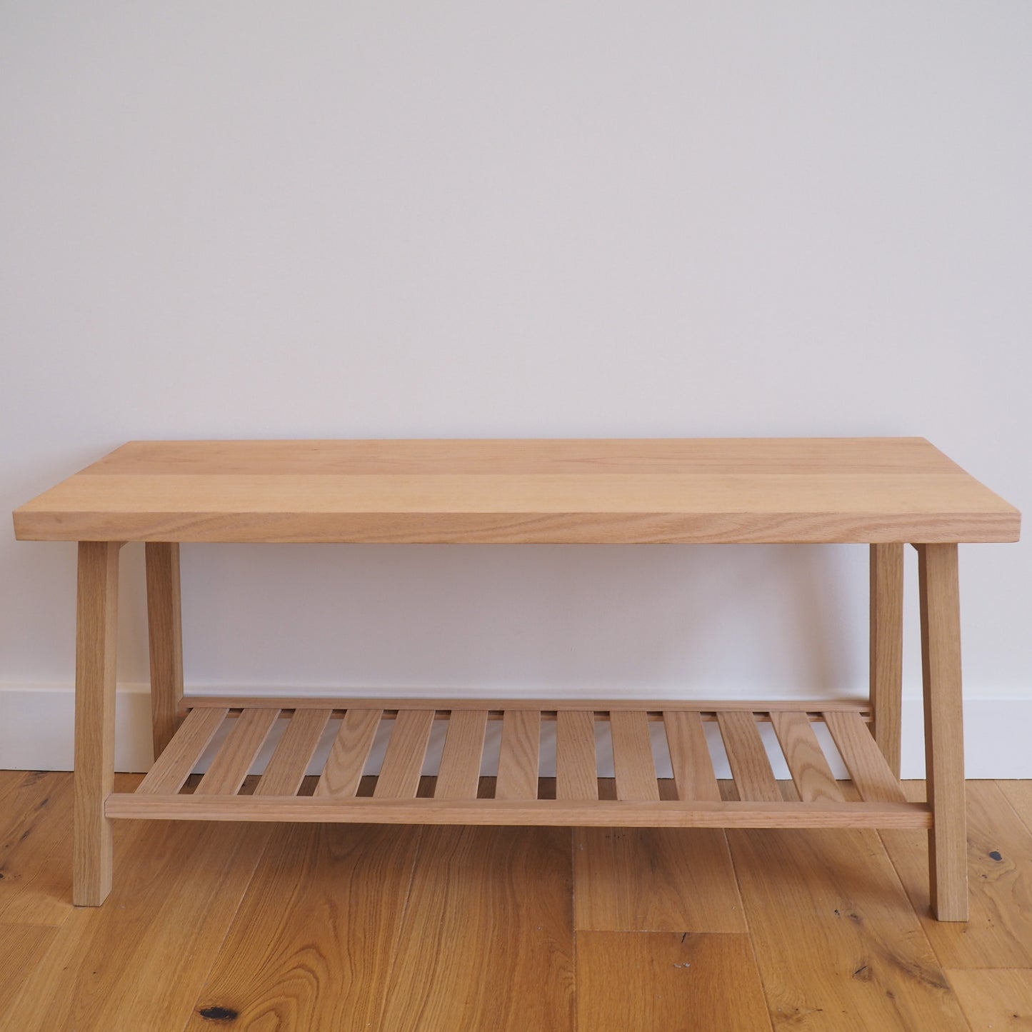 Solid Oak bench with shoe storage.