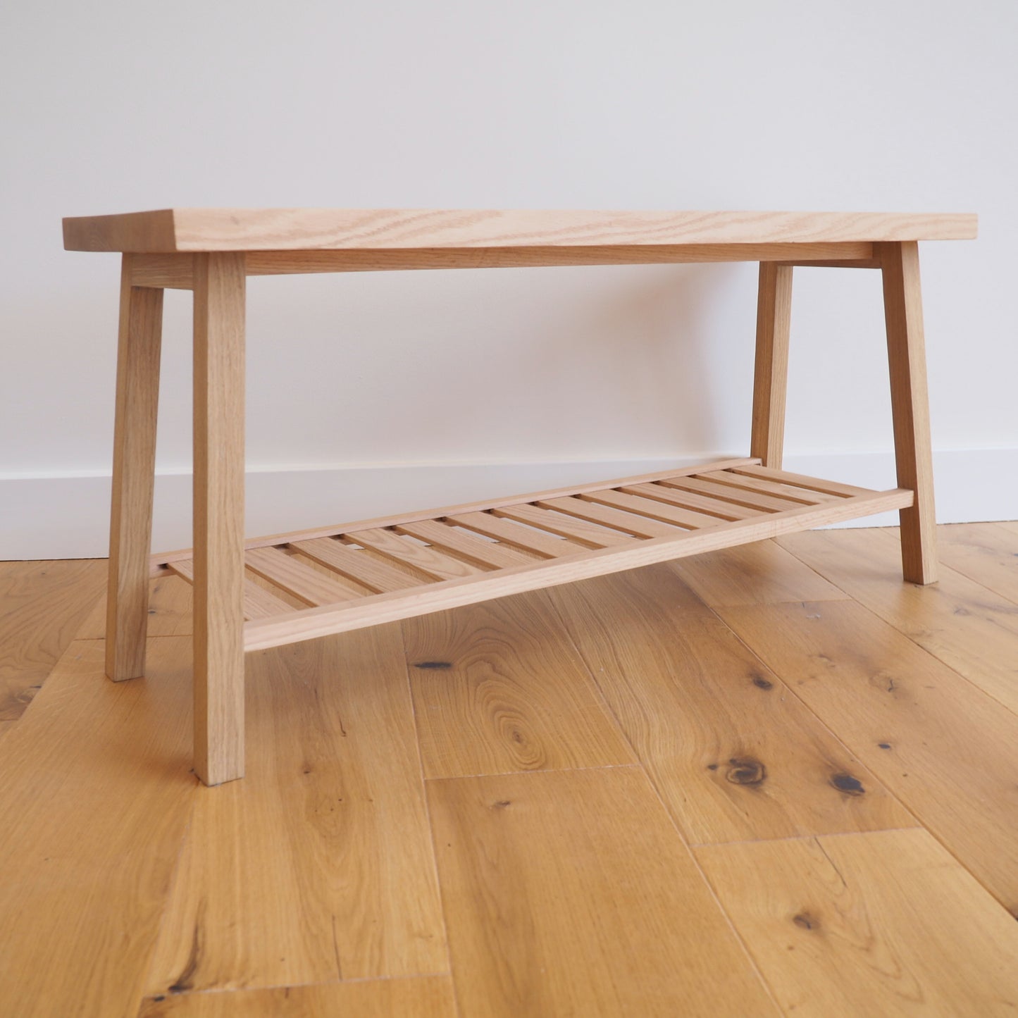 Solid Oak bench with shoe storage.