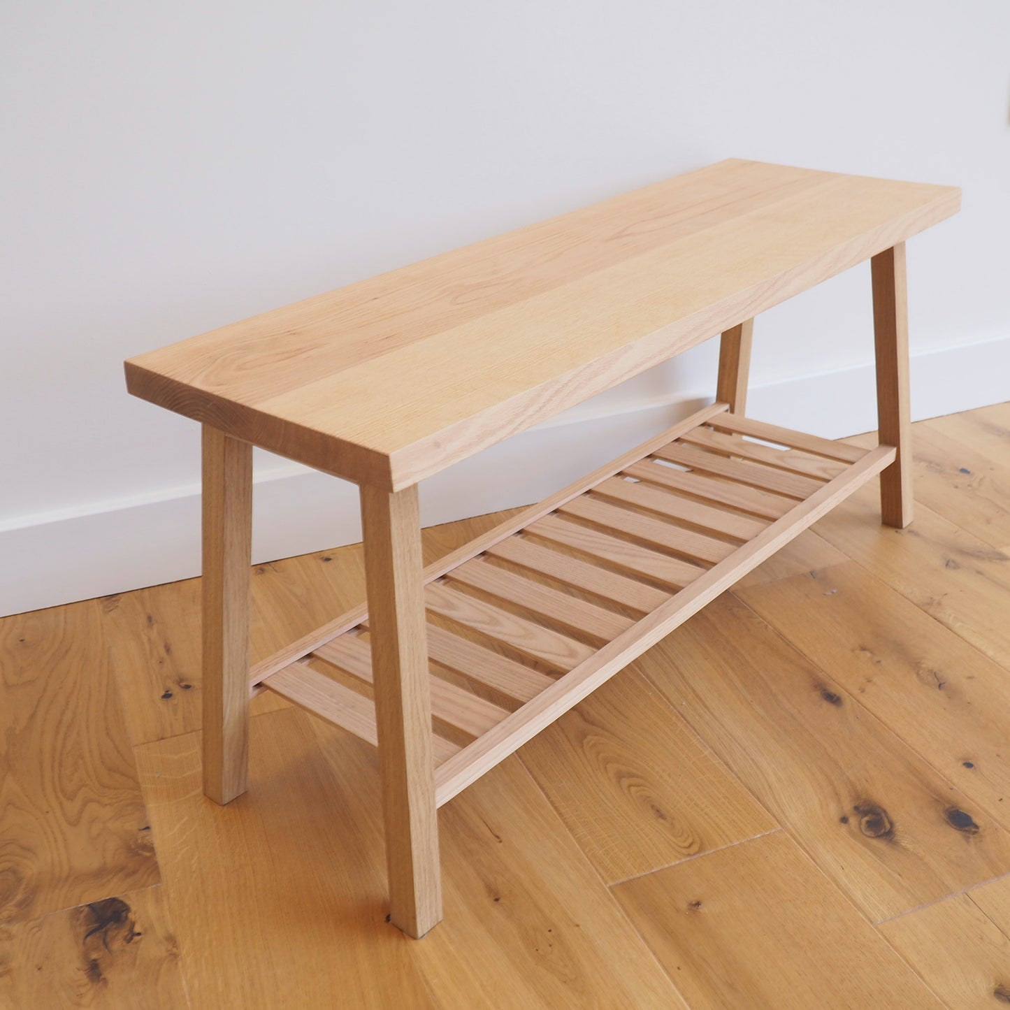 Solid Oak bench with shoe storage.