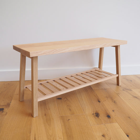 Solid Oak bench with shoe storage.