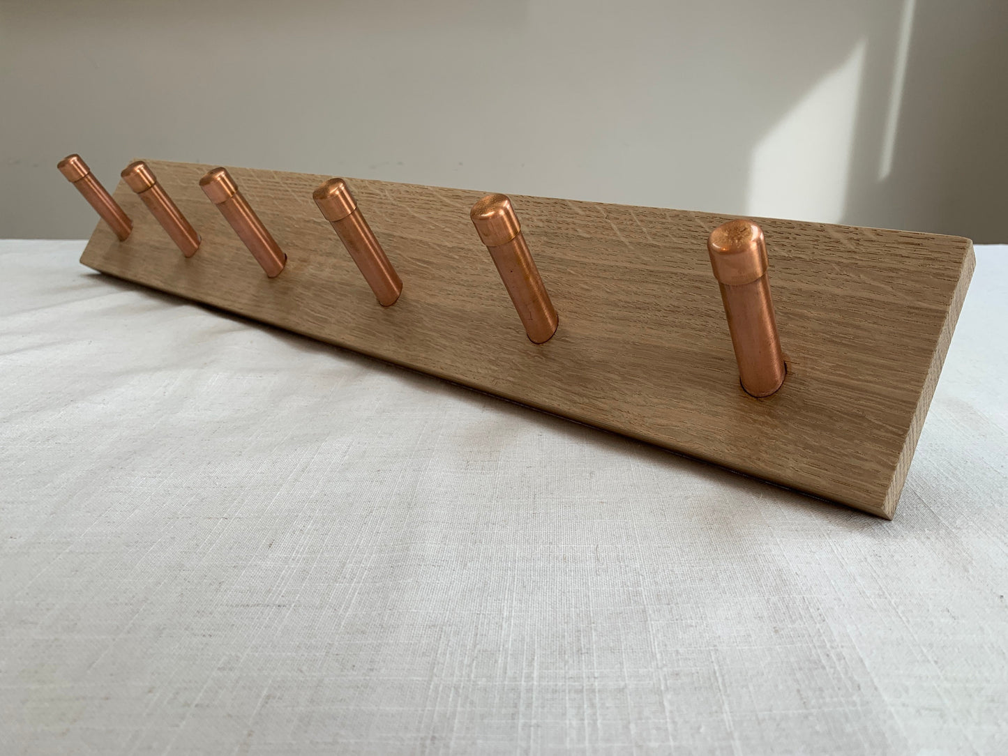 Oak coat hook peg rail with Copper pegs