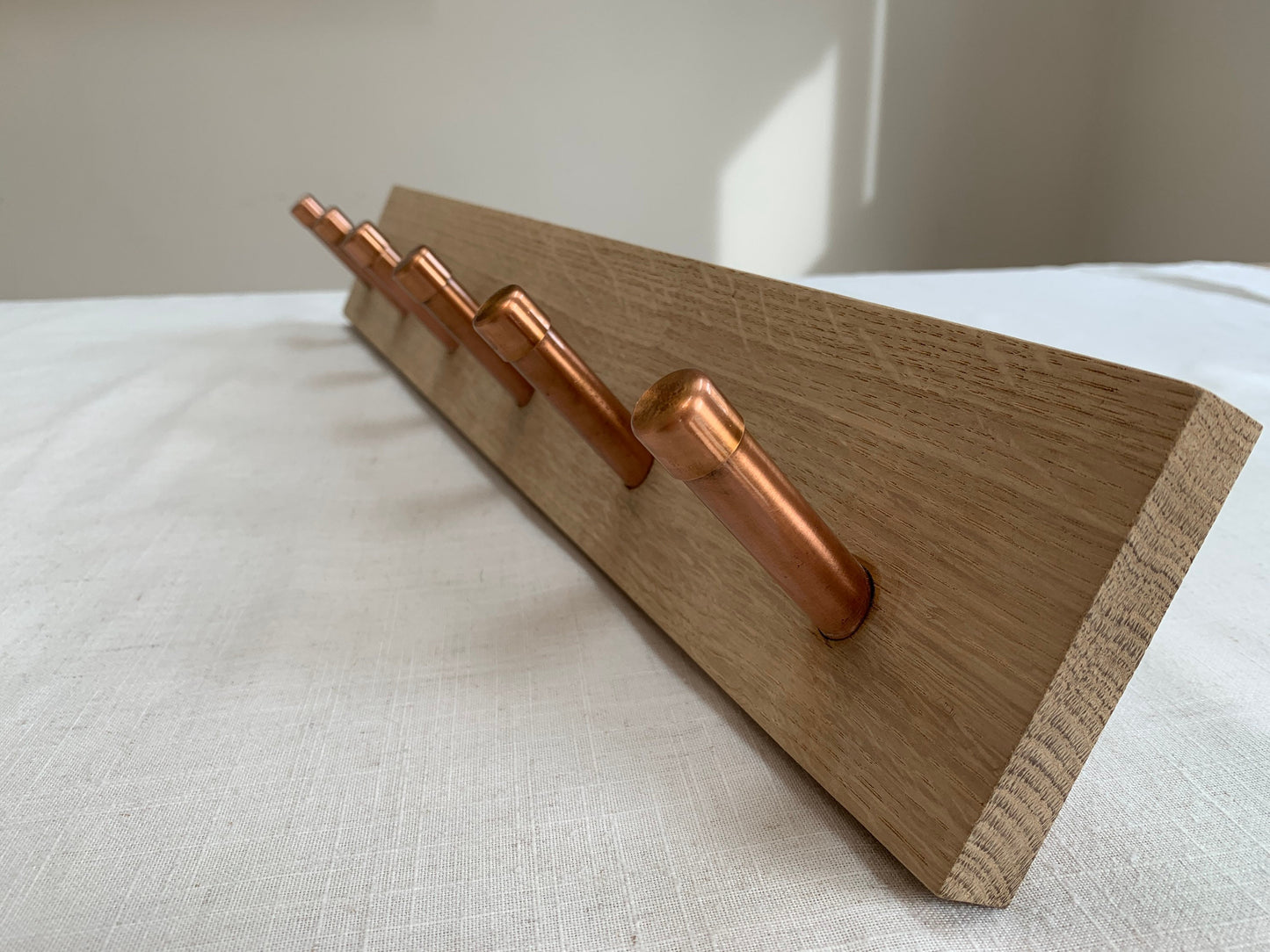 Oak coat hook peg rail with Copper pegs